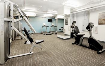 Fitness center with cardio and weight lifting machines at Eden Commons, Illinois
